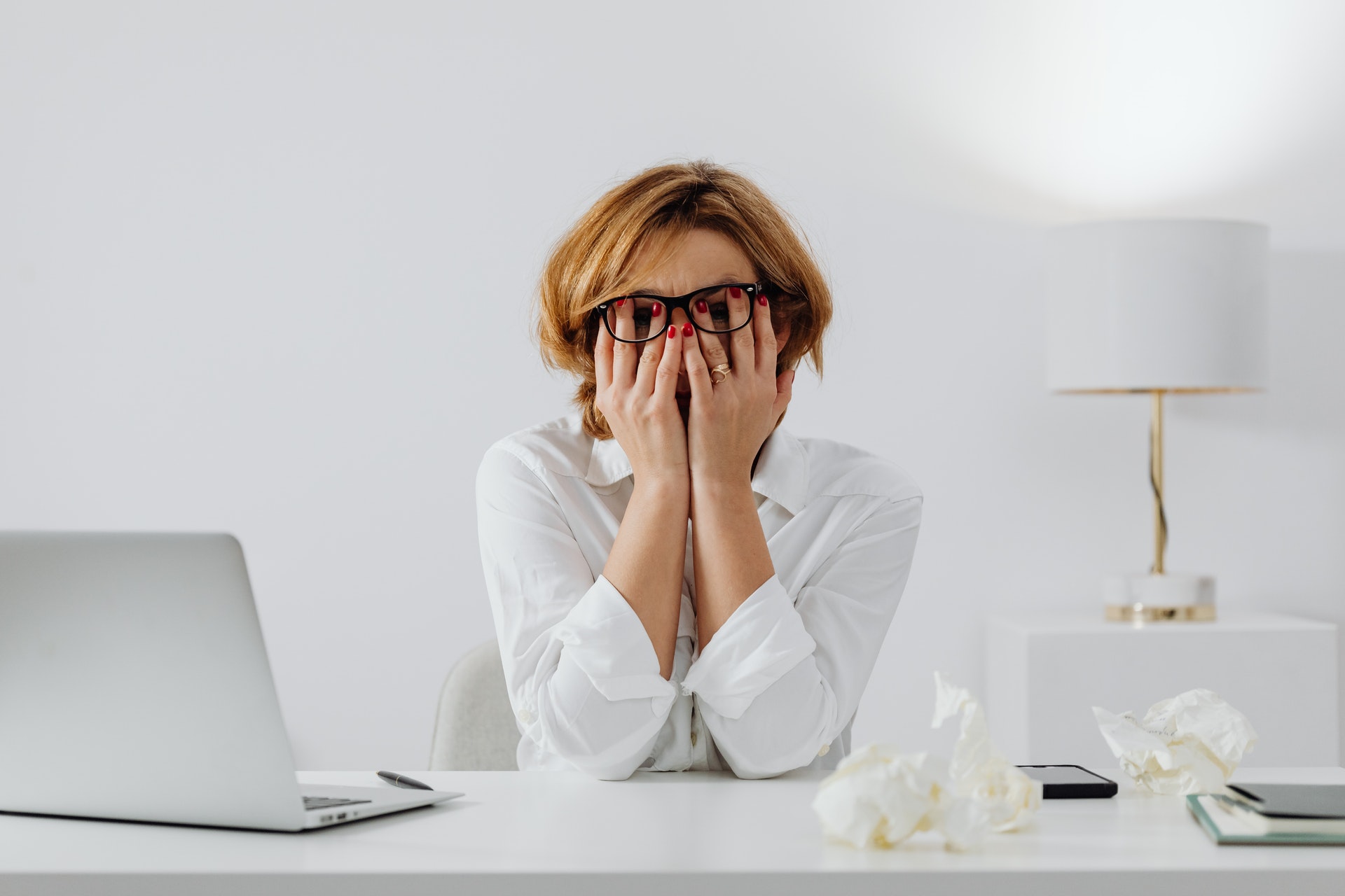 Woman stressed at work desk